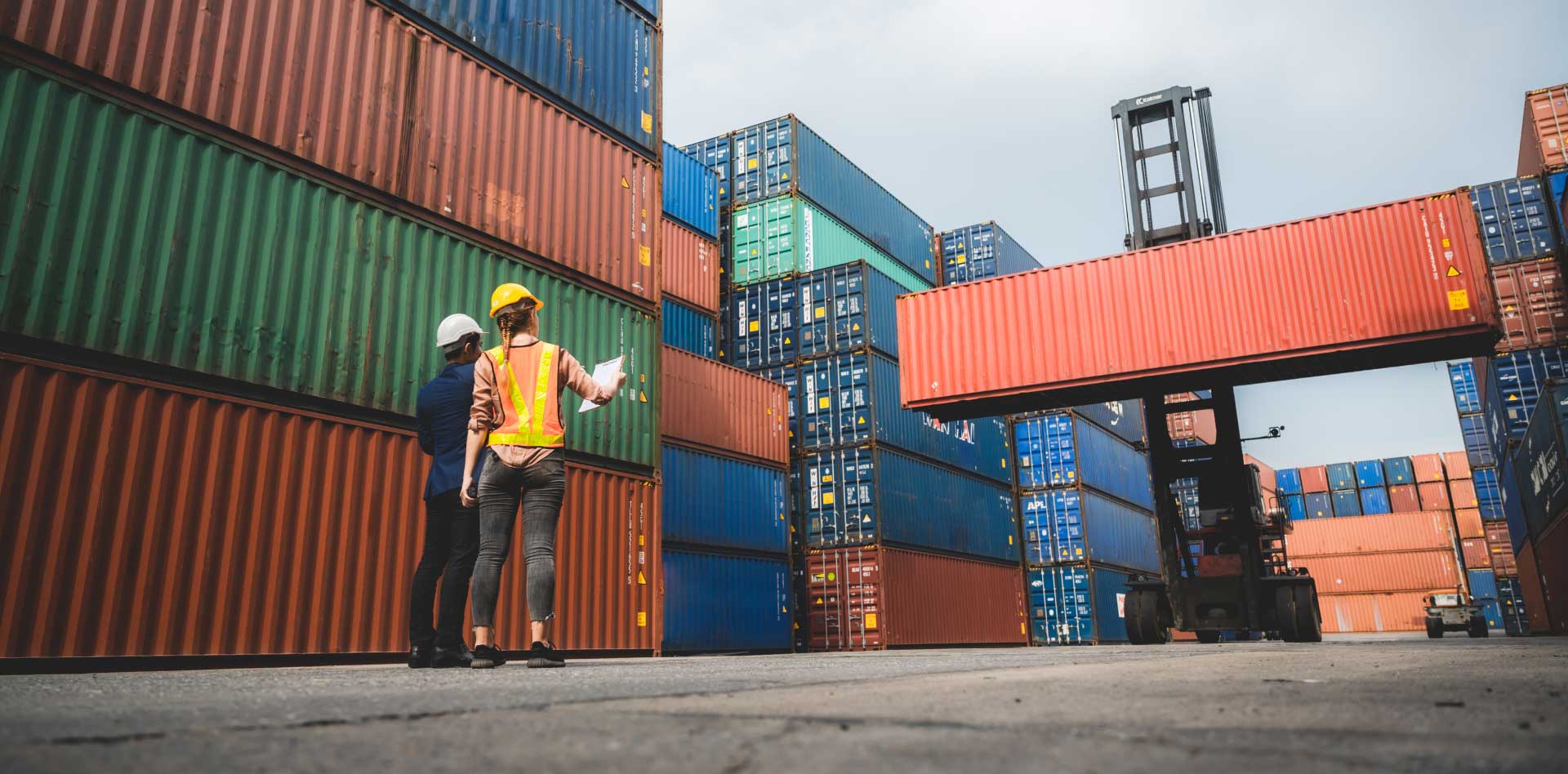 Stacks of containers at a port– showcasing achievements in digital logistics for shippers, importers, and community-based solutions for forwarders